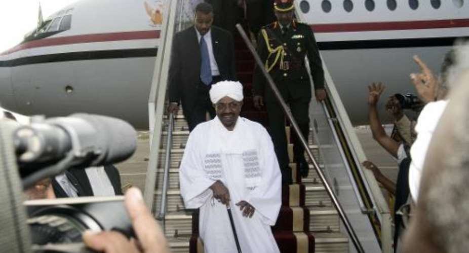 Sudanese President Omar al-Bashir arrives in Khartoum after a flight from Johannesburg on June 15, 2015.  By Ebrahim Hamid AFPFile
