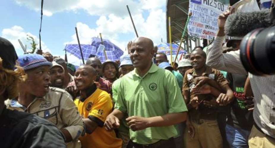 President of south Africa's AMCU union Joseph Mathunjwa leads a rally of striking miners near Lonmin's platinum mine in Marikana on January 23, 2014.  By Alexander Joe AFPFile