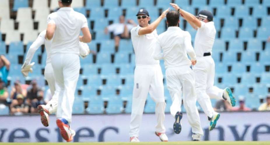 England celebrate the dismissal of South African batsman Dean Elgar on the first day of the fourth Test in Centurion on January 22, 2016.  By Gianluigi Guercia AFP