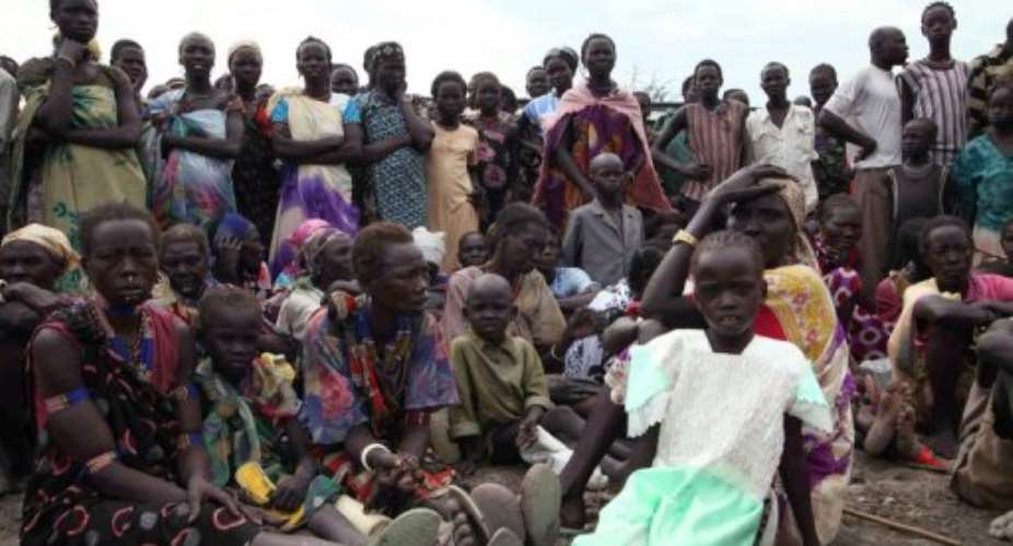 Displaced people in Pibor, South Sudan, wait for food in January 2012.  By Hannah Mcneish AFPFile
