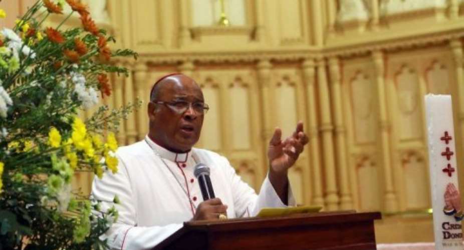 Cardinal Wilfrid Fox Napier, the Archbishop of Durban, addresses worshippers in Durban, on February 10, 2013.  By Rajesh Jantilal AFPFile