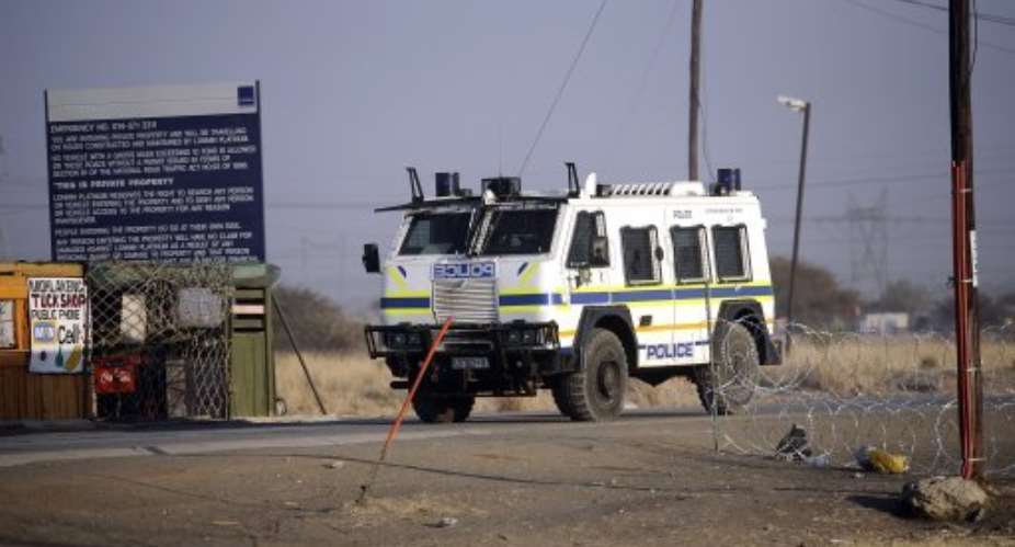 A police vehicle parked outside the Marikana platinum mine on August 21, 2012.  By Stephane de Sakutin AFPFile
