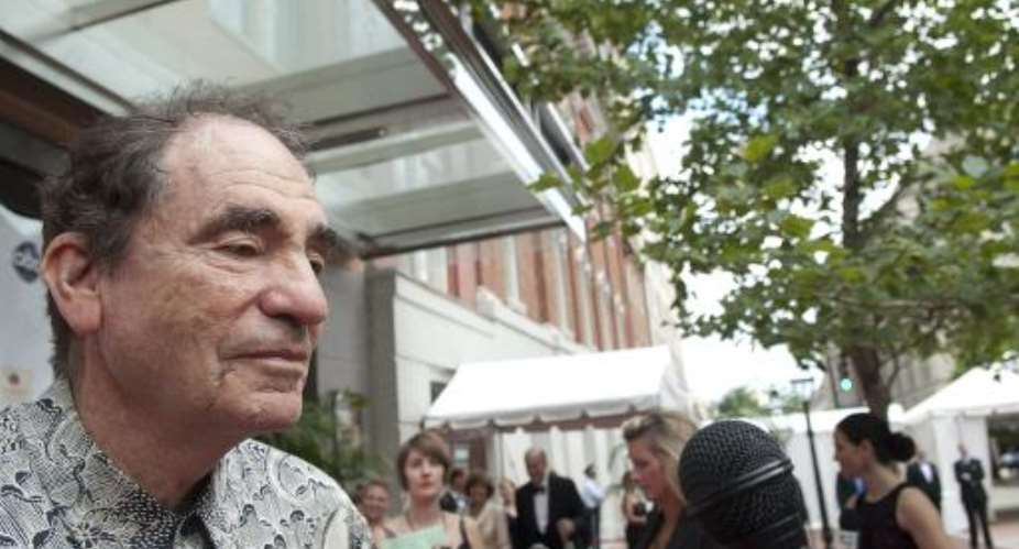 Albie Sachs speaks with a reporter on the red carpet during the Fords Theatre Society Annual Gala at Fords Theatre in Washington, DC on June 6, 2010.  By Kris Connor (Getty/AFP/File)
