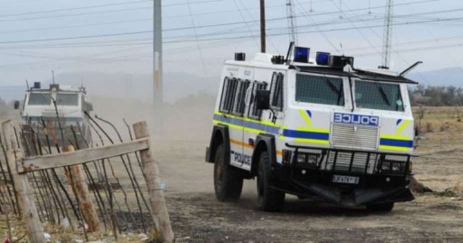 South African police use trucks against stricking miners in Marikana, September 15, 2012 at Lonmins platinum mine.  By Alexander Joe (AFP/File)