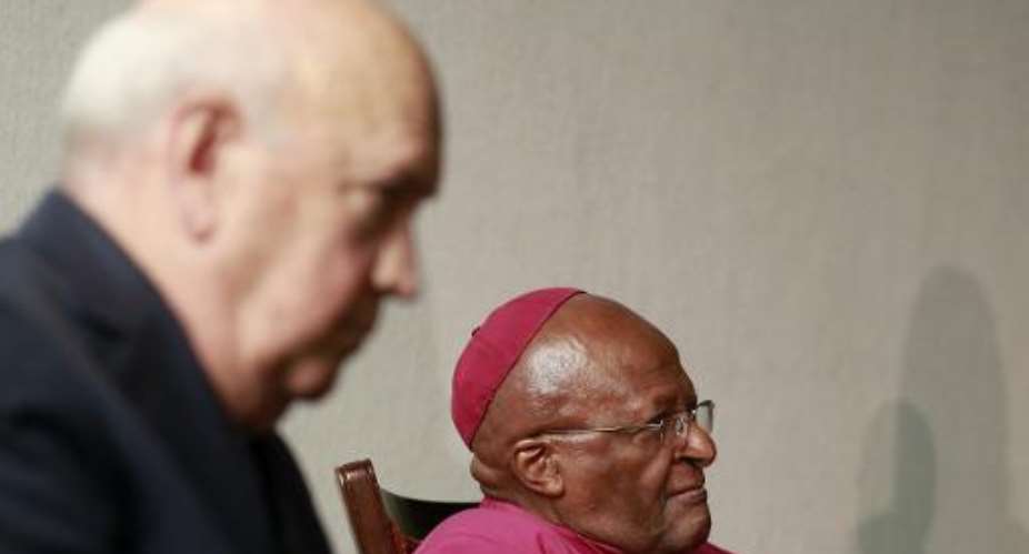 Former South African President and Nobel Peace Laureate F. W. De Klerk L and Nobel Peace prize laureate Archbishop Desmond Tutu on July 18, 2014 in Cape Town, South Africa.  By Jennifer Bruce AFP