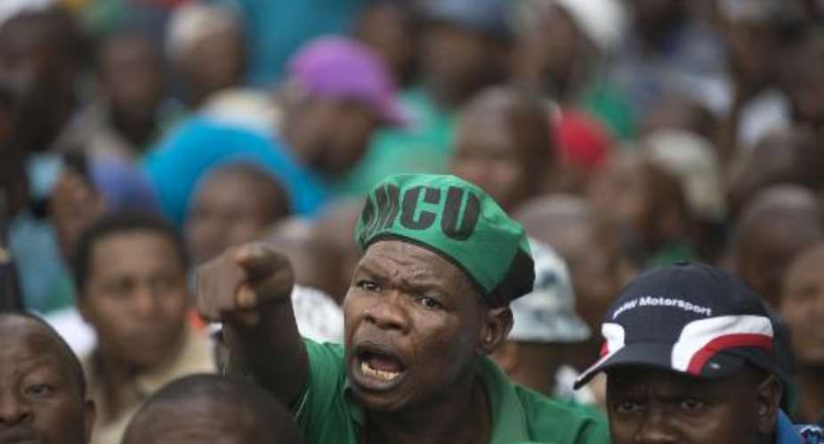 AMCU Association of Mineworkers and Construction Union members march in Johannesburg on March 27, 2014.  By Mujahid Safodien AFPFile