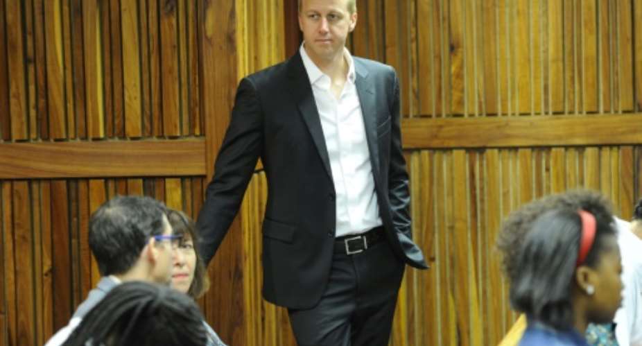 TV host Gareth Cliff waits at Johannesburg high court, prior to a hearing regarding the ruling against his layoff on January 29, 2015.  By  AFP