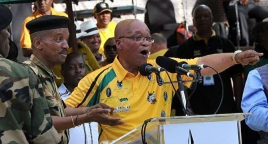 South Africa's president Jacob Zuma sings during celebrations in Bloemfontein.  By Alexander Joe AFP