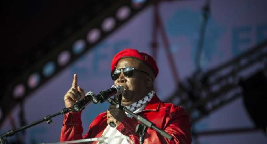 Julius Malema, Commander in Chief of the South African political party Economic Freedom fighters, addresses a crowd of supporters at a rally in Soweto on July 26, 2014.  By Mujahid Safodien AFPFile