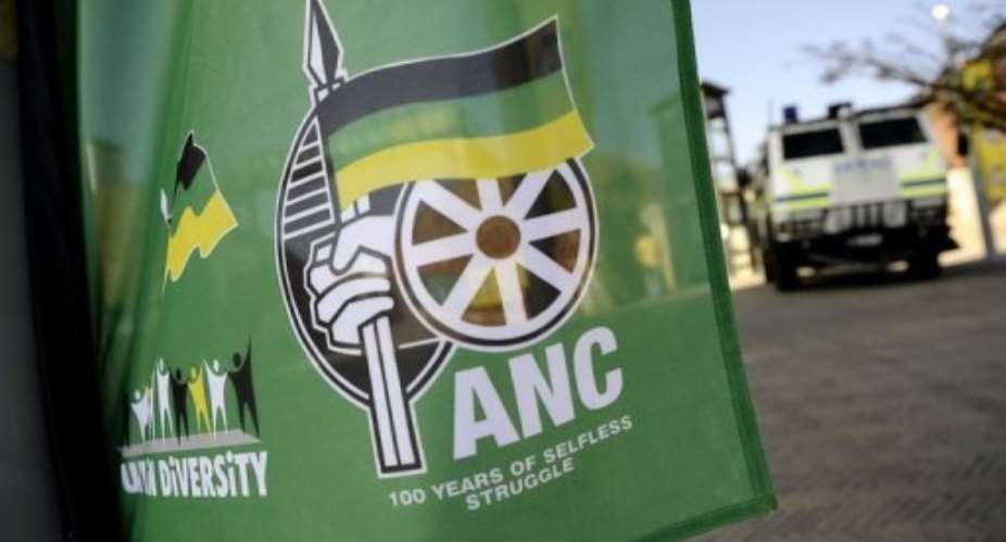 A flag displaying African National Congress (ANC) current logo (R).  By Stephane de Sakutin (AFP/File)