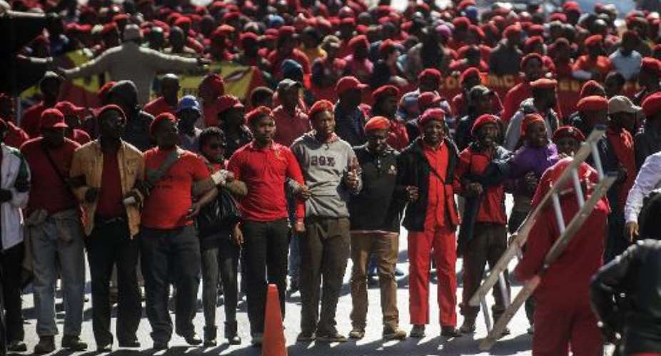 More than a thousand South African opposition party members from the Economic Freedom Fighters march to the Gauteng Legislature during a protest in Johannesburg on July 22, 2014.  By Gianluigi Guercia AFP