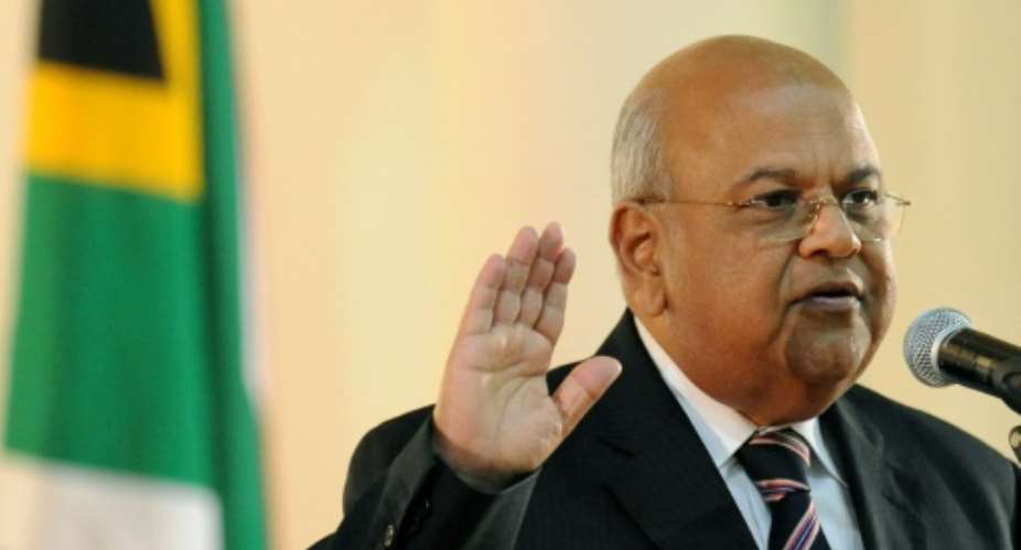 Pravin Gordhan, who served as South Africa's finance minister from 2009 to 2014, was re-appointed to the role after the rand fell to an all-time low of 16 to the dollar.  By Alexander Joe AFPFile
