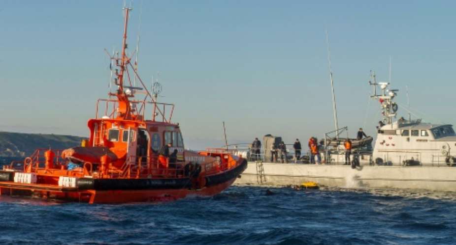Sailors with the Spanish emergency services L and the Moroccan Navy rescue would-be immigrants in the Straits of Gibraltar in December 2012.  By MARCOS MORENO AFPFile