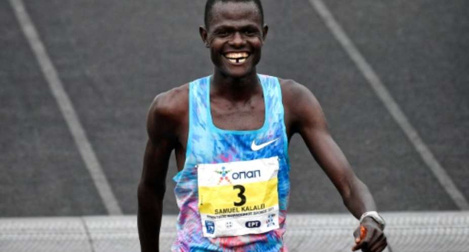 Samuel Kalalei of Kenya runs to win the 35th Athens Marathon at the Panathenaic stadium in Athens on November  12, 2017.  By LOUISA GOULIAMAKI AFP