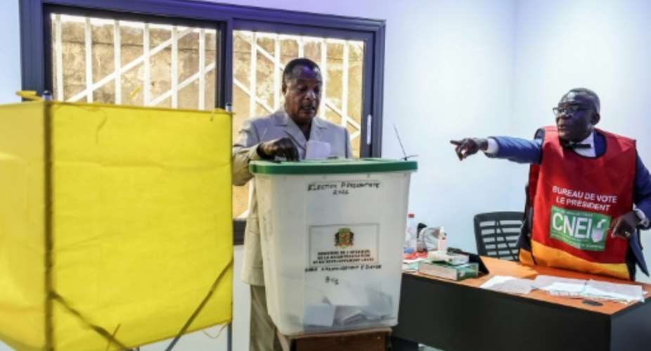 Sassou Nguesso cast his ballot at a polling station in Brazzaville.  By Daniel BELOUMOU OLOMO (AFP)