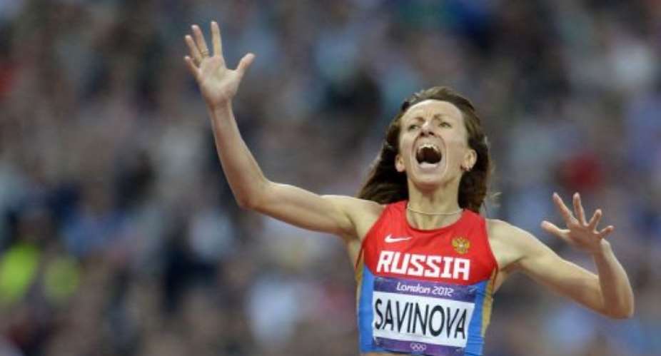 Russia's Mariya Savinova celebrates after winning the women's 800m final.  By Eric Feferberg AFP