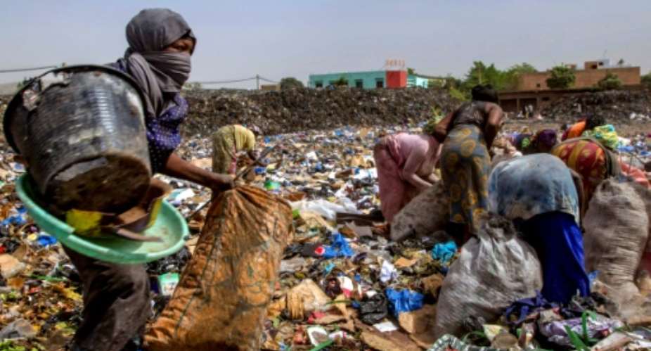 Scavengers look for reusable or recyclable material at a dump in Bamako, Mali.  By SEBASTIEN RIEUSSEC AFPFile