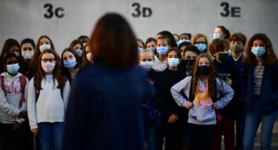 Schools reopened in Russia, Ukraine, Belgium and France, where teachers and their pupils aged 11 and older were obliged to wear face coverings.  By Martin BUREAU AFP
