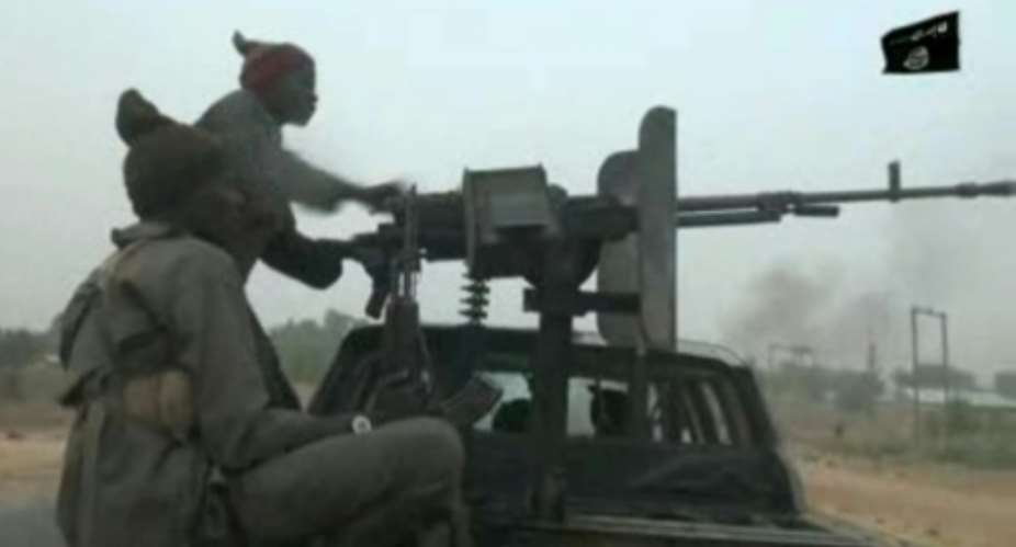 Screen grab from a Boko Haram video, released on January 2, showing an attack on a military checkpoint at a village on the outskirts of the northeast city of Maiduguri on December 25.  By Handout BOKO HARAMAFP