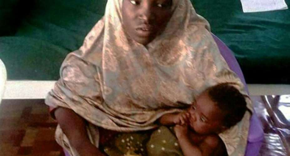 Amina Ali with her young baby was rescued by Nigerian authorities on May 18, 2016 after being one of 219 girls abducted by Boko Haram gunmen in 2014.  By  AFP