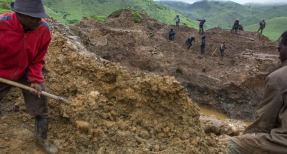 Self-employed miners digging for cassiterite near Numbi in hilly eastern Democratic Republic of Congo..  By Griff Tapper AFPFile