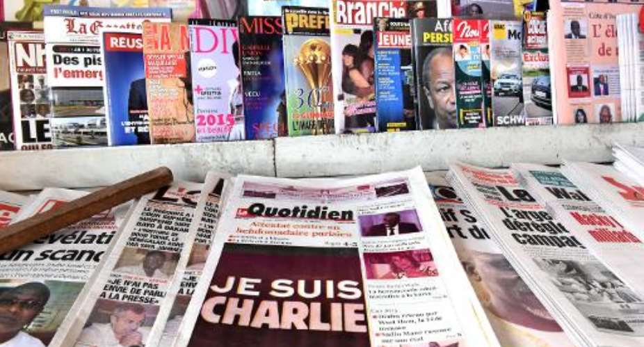 Covers of Senegals newspapers following the Islamist attack against French satirical weekly newspaper Charlie Hebdo, on January 8, 2015, in Dakar.  By Seyllou Diallo (AFP/File)