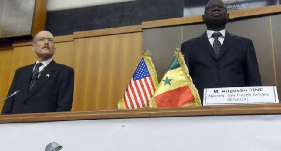 US Ambassador to Senegal James Peter Zumwalt L and Senegalese Defense Minister Augustin Tine attend the opening of the African Land Forces summit on February 9, 2015.  By Seyllou AFP