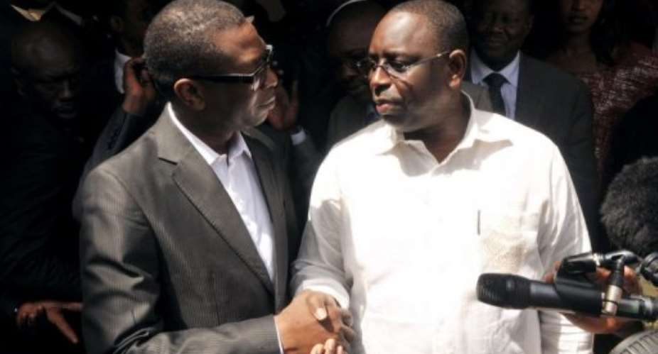 Opposition presidential candidate Macky Sall R and Senegalese singer Youssou Ndour.  By Seyllou AFPFile
