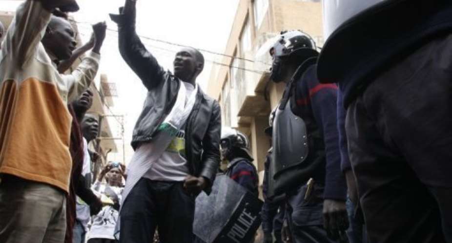 Protesters face off with riot police on February 15.  By Mamadou Toure Behan AFPFile