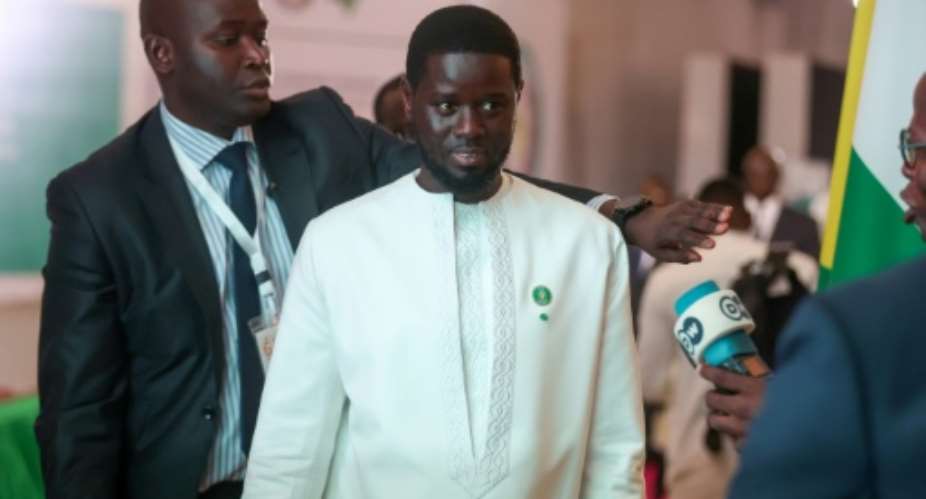 Senegal President Bassirou Diomaye Faye, seen in July 2024, unveiled his new Kiiraay party in Dakar.  By Kola Sulaimon (AFP)