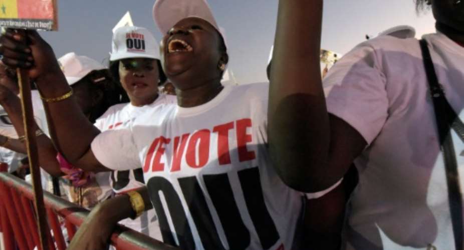 A supporter for the yes at a referendum on sweeping constitutional reforms gestures on March 18, 2016 in Dakar.  By Seyllou (AFP/File)