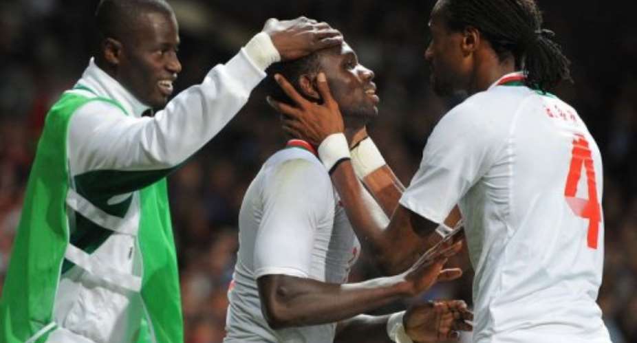 Senegals Moussa Konate (C) celebrates after scoring.  By Andrew Yates (AFP)
