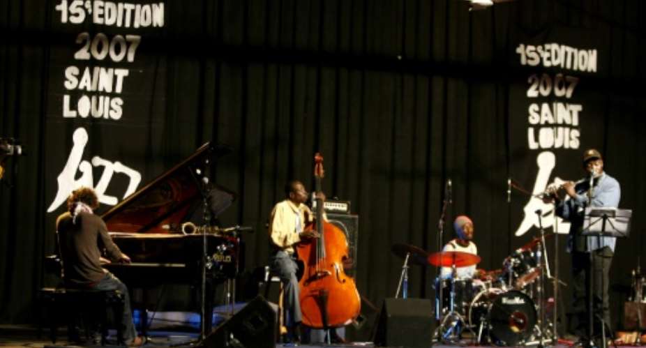 African Touch Sextet group performs on stage 25 May 2007 during the second night of the 15th Saint Louis Jazz Festival in Saint Louis, Senegal.  By Georges Gobet AFP