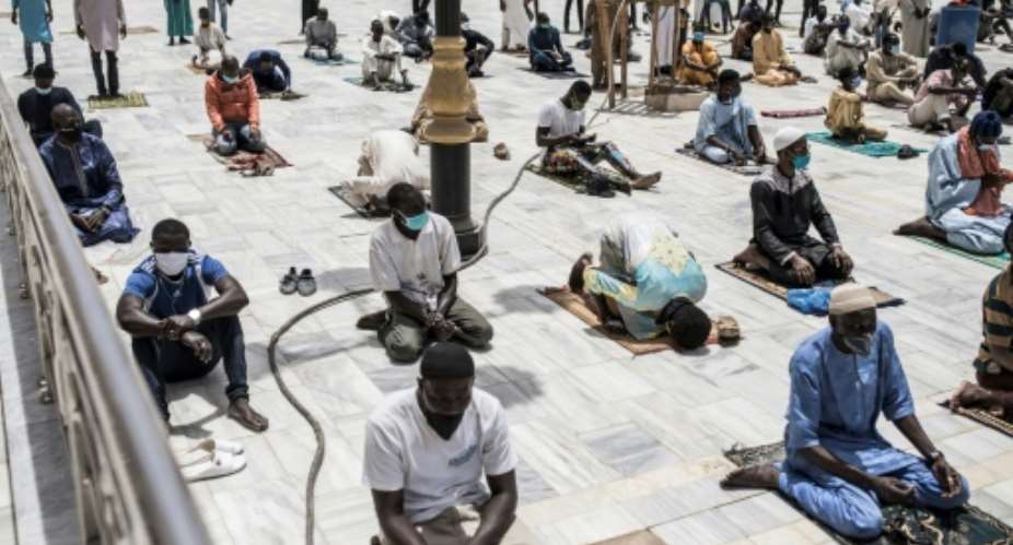 Senegalese Muslim worshippers in Dakar kept up with social distancing practises before Friday prayers.  By JOHN WESSELS AFP