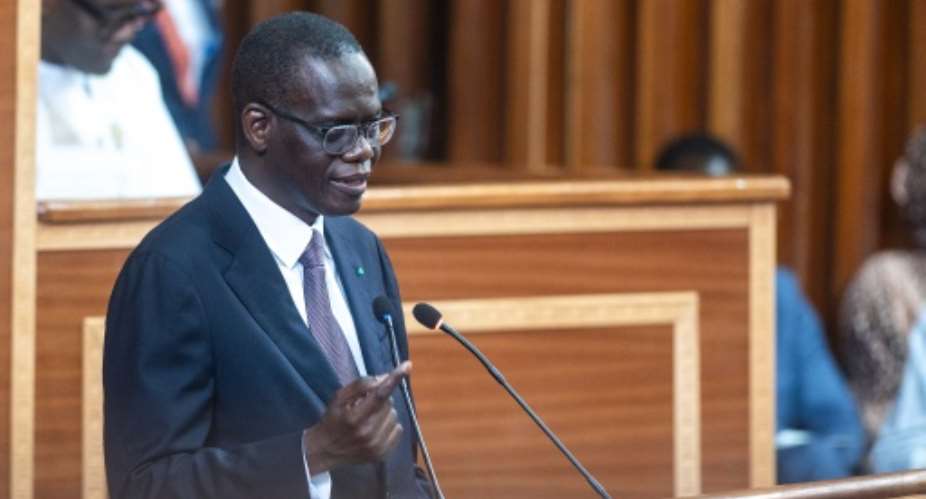 Senegalese Prime Minister Ahmadou Al Aminou Mohamed Lo faces an uphill task to get the governments budget through parliament.  By SEYLLOU (AFP)