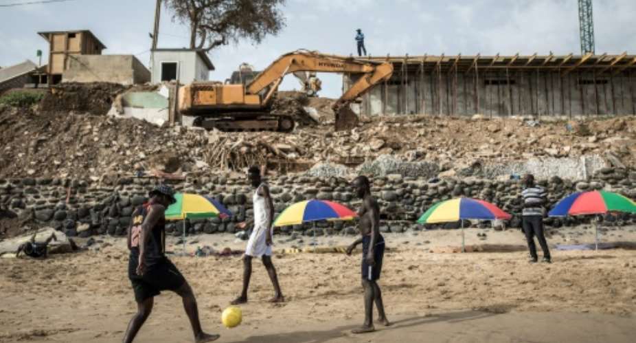 Senegals capital Dakar has undergone rampant construction including along its beachfront.  By JOHN WESSELS (AFP/File)