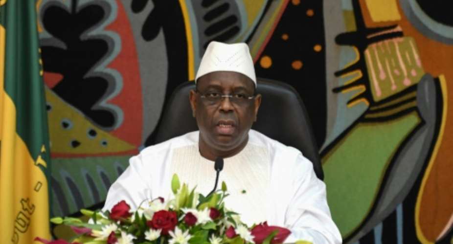 Senegal's President Macky Sall pictured May 2019 rejected corruption allegations against his brother and vowed the government would pursue the matter, adding: I want the truth to be reestablished.  By Seyllou AFPFile