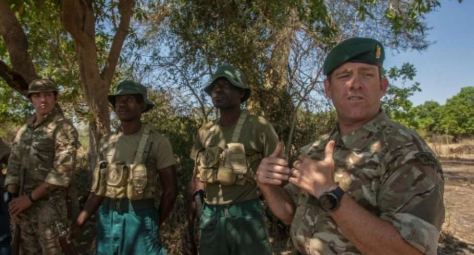 Seven British soldiers are in Malawi to train 35 of the country's anti-poaching rangers.  By Amos Gumulira AFP