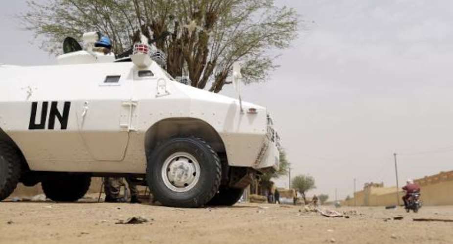 A United Nations patrol is seen in the northern Malian city of Kidal, on July 27, 2013.  By Kenzo Tribouillard AFPFile