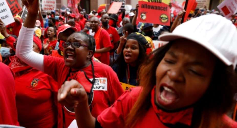 Several unions including groups representing nurses, post office employees and police officers joined scaled-down demonstrations across the country.  By Phill Magakoe AFP