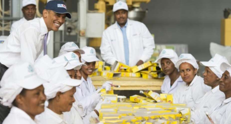 US President Barack Obama top left visits the Faffa Food factory, producing low-cost and high-protein foods, in Addis Ababa, on July 28, 2015.  By Saul Loeb AFPFile