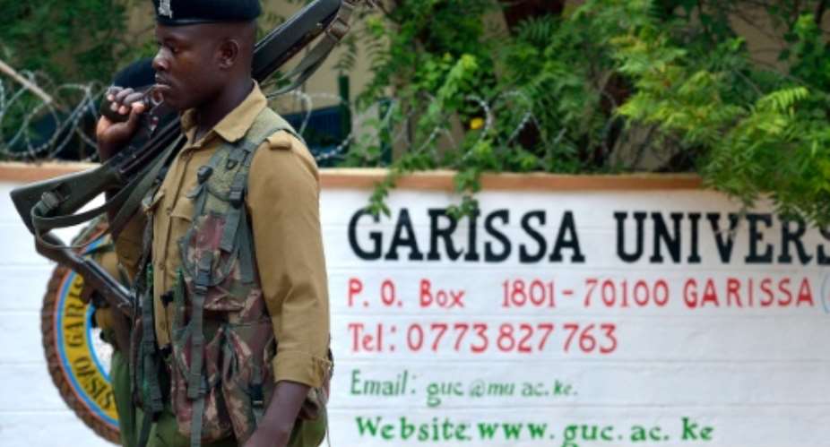 A Kenyan soldier stands guard at the entrance of Garissa University after it re-opened nine after a deadly siege by Shebab gunmen in April 2015.  By Tony Karumba AFP