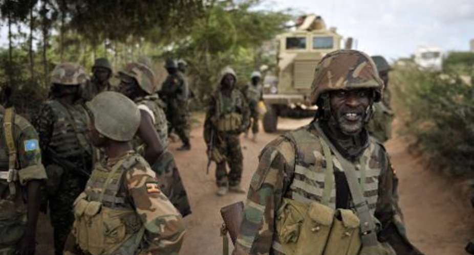 A picture released by AMISON on August 30, 2014 shows soldiers celebrating after liberating the town of Bulomarer in Somalia's Lower Shabelle region on August 30, 2014.  By Tobin Jones AMISONAFPFile