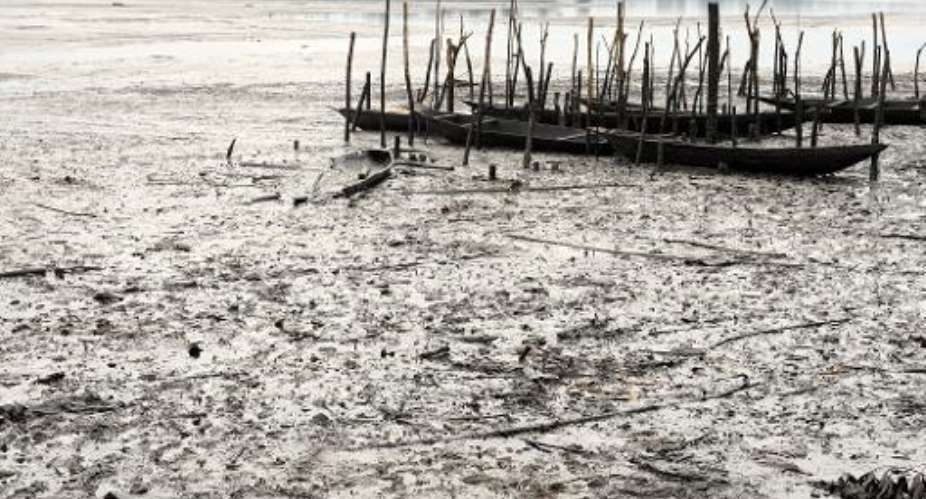 Fishing boats are abandoned on Bodo waterways polluted by spilled crude oil allegedly caused by Shell equipment failure in Ogoniland, Nigeria, August 11, 2011.  By Pius Utomi Ekpei AFPFile