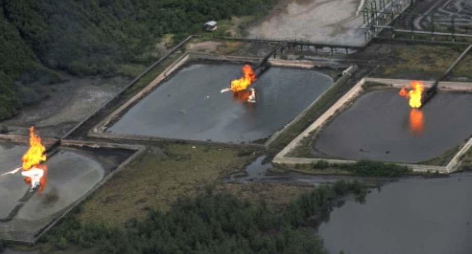 Gas flare is seen at Shell Cawtharine Channel, Nembe Creek in the Niger Delta on March 22, 2013.  By Pius Utomi Ekpei AFPFile