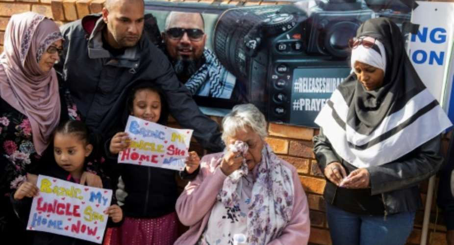 Shiraaz Mohamed's family campaigned for his release on election day last May outside a Johannesburg polling station where President Cyril Ramaphosa was to cast his vote.  By WIKUS DE WET AFP