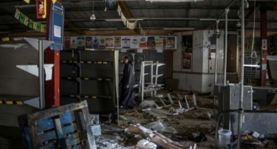 Shop owners estimate that losses run into millions of rand after looting during anti-migrant marches in South Africa.  By MARCO LONGARI (AFP)