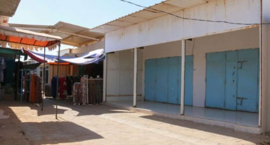 Shops are shuttered at a market in Tunisia's southern town of Ben Guerdane, near the Libyan border.  By FATHI NASRI (AFP)