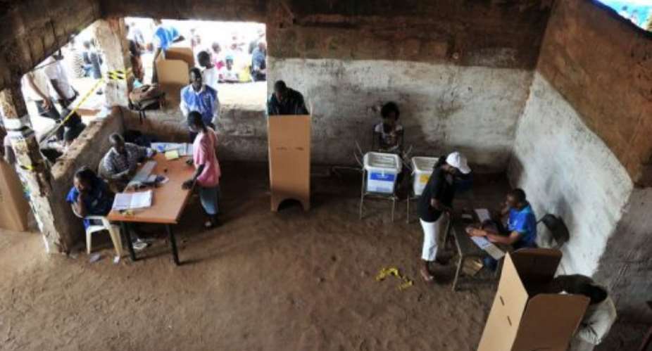 Residents prepare to casts their votes in Freetown.  By Issouf Sanogo (AFP)