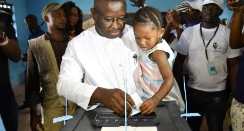 Sierra Leone's people party presidential candidate former general Julius Maada Bio casts his ballot at the polling station in Freetown on March 31, 2018 during Sierra Leone presidential run-off.  By ISSOUF SANOGO AFPFile